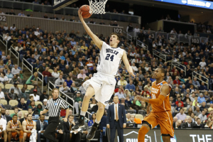 Mar 19, 2015; Pittsburgh, PA, USA; Butler Bulldogs guard Kellen Dunham (24) shoots the ball in front of Texas Longhorns forward Jonathan Holmes (10) during the first half in the second round of the 2015 NCAA Tournament at Consol Energy Center. (Geoff Burke-USA TODAY Sports) <br/>