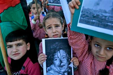 Palestinian children take part in a protest against Israel's military operation in Gaza, in the West Bank village of Nilin, near Modin, Tuesday, Jan. 6, 2009. <br/>Photo: AP Images / Muhammed Muheisen