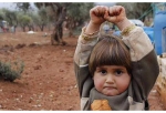 Heartbreaking Photo of Syrian Girl Raising Hands in Surrender