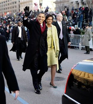 President Barack Obama and first lady Michelle Obama walk down Pennsylvania Avenue en route to the White House, Tuesday, Jan. 20, 2009. <br/>(Photo: AP Images / Doug Mills, Pool)