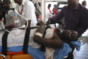 Medics help an injured person at Kenyatta national Hospital in Nairobi, Kenya, Thursday, April , 2, 2015 , after being airlifted from Garissa after an attack by gunmen at Garissa University College in northeastern Kenya. <br/>AP Photo