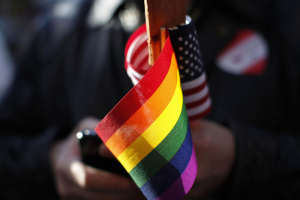 The gay pride and American flag are seen at a demonstration. Photo by Stephen Lam/Reuters <br/>