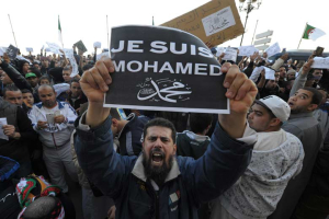 A demonstrator holds up a “Je suis Mohamed” sign during a protest following the attacks on French satirical newspaper Charlie Hebdo. <br/>AP Photo
