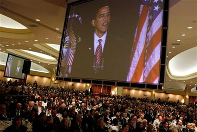 President Barack Obama is seen on video screens as he speaks at the National Prayer Breakfast in Washington, Thursday, Feb. 5, 2009. <br/>(Photo: AP Images / Charles Dharapak)