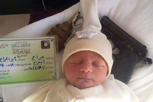 The image of a newborn baby pictured next to a handgun, grenade and Islamic State birth certificate was posted to ISIS-linked Twitter accounts. <br/>Twitter