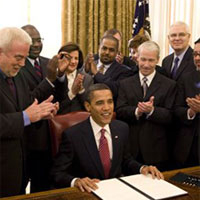 Dr. Joel C. Hunter standing right of President Obama <br/>