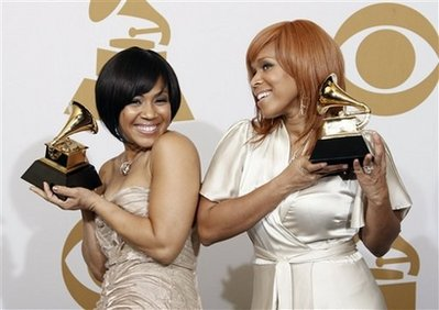 Tina Campbell, left, and Erica Monique Atkins of Mary Mary hold their best gospel performance awards for 'Get Up' backstage at the 51st Annual Grammy Awards on Sunday, Feb. 8, 2009, in Los Angeles. <br/>(Photo: AP Images / Matt Sayles)