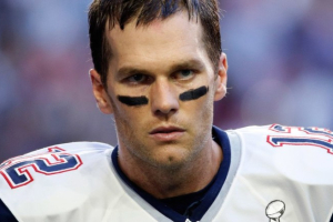 New England Patriots quarterback Tom Brady will be suspended for the first four games of the 2015 season for his knowledge of deflated footballs during the 2014 playoff game against the Indianapolis Colts. <br />
 <br/>AP Photo