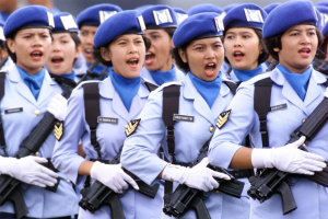 Indonesian women air force troops sing a military song during a parade during celebrations to mark the 55th annivesary of the air force in Jakarta. Reuters <br/>
