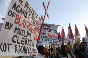 Pakistani human rights activists condemn the killing of the Christian couple for alleged blasphemy during a demonstration in Islamabad, Pakistan, in November. B.K. Bangash/AP <br/>