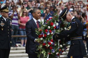 U.S. President Barack Obama positions a commemorative wreath during a ceremony on Memorial Day at the Tomb of the Unknowns at Arlington National Cemetery on May 27, 2013 in Arlington, Virginia. (Photo by Mark Wilson/Getty Images) <br/>