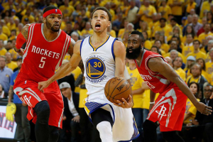 Golden State Warriors guard Stephen Curry (30) runs between Houston Rockets forward Josh Smith (5) and guard James Harden (13) during the fourth quarter of Game 1 of the NBA Western Conference Finals at Oracle Arena on Tuesday, May 19, 2015, in Oakland. ( James Nielsen / Houston Chronicle ) <br/>