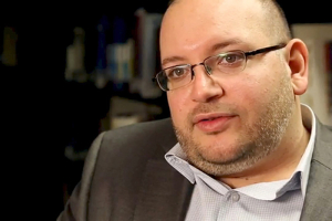 Washington Post reporter Jason Rezaian speaks in the newspaper's offices in Washington, DC in a November 6, 2013 file photo provided by The Washington Post. Iran is charging Rezaian with four crimes, including espionage, the newspaper said on Monday in a report offering the first details about the exact charges against him. REUTERS <br/>