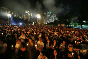 Tens of thousands of people take part in a candlelight vigil at Hong Kong's Victoria Park June 4, 2014, to mark the 25th anniversary of the military crackdown on the pro-democracy movement at Beijing's Tiananmen Square in 1989. REUTERS / BOBBY YIP <br/>