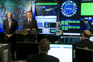 U.S. President Barack Obama delivers remarks at the National Cybersecurity and Communications Integration Center (NCCIC) on January 13, 2015 in Arlington, Virginia. President Obama discussed efforts to improve the government's ability to collaborate with industry to combat cyber threats. He is joined by Secretary of Homeland Security Secretary Jeh Johnson. (Jan. 12, 2015 - Source: Pool/Getty Images North America) <br/>