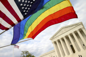 An American flag and a rainbow colored flag flies in front of the Supreme Court in Washington, April 27, 2015. Andrew Harnik—AP <br/>