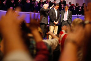 Republican presidential candidate and former U.S. Senator Rick Santorum (C) receives a blessing from Pastor Dennis E. Terry, Sr. (L) after being interviewed by Family Research Council President Tony Perkins (R) at Greenwell Springs Baptist Church in Greenwell Springs, Louisiana March 18, 2012. <br/>(Photo: REUTERS/Sean Gardner)