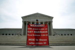 Christine Weick protests against gay marriage in front of the U.S. Supreme Court in Washington June 8, 2015. A ruling on Obergefell v. Hodges, and whether the U.S. Constitution's guarantees of due process and equal protection under the law covers a right to same-sex marriage; and, if not, whether states that ban same-sex marriages must recognize those performed elsewhere, is expected from the Court by month's end. REUTERS/Gary Cameron <br/>