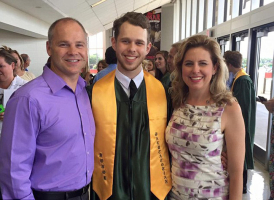 Aaron Rose is pictured standing with his parents at his graduation. Photo: Facebook <br/>
