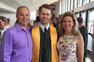 Aaron Rose is pictured standing with his parents at his graduation. Photo: Facebook <br/>