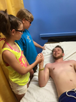 Aaron Rose lies in the hospital bed as his siblings stand by. (Facebook/MaryBethRose) <br/>