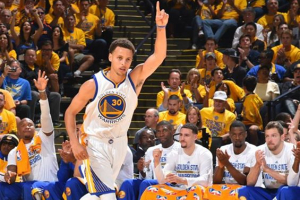 Stephen Curry points index finger up to give glory to God after scoring a three-pointer. <br/>NBA TV