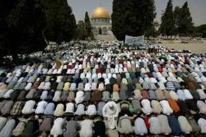 With the Dome of the Rock Mosque seen in the background, Palestinian Muslim worshippers pray, during the first Friday prayers of the holy fasting month of Ramadan, in the Al-Aqsa Mosque compound in Jerusalem’s Old City, Friday, Sept. 5, 2008.  <br/>AP / Muhammed Muheisen