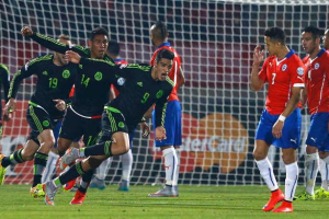 Mexico's Raul Jimenez (9) celebrates after scoring against Chile during their first round Copa America 2015 soccer match at the National Stadium in Santiago, Chile, June 15, 2015. REUTERS/Ivan Alvarado <br/>