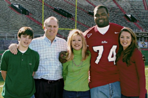 Michael Oher (r-2) and his adopted family, the Tuohys.  <br/>