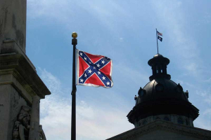 South Carolina Gov. Nikki Haley has said the Confederate flag should be removed from the Statehouse grounds, but she also says the symbol will always remain a part of the state. <br/>AP Photo