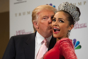 Donald Trump kisses newly crowned Miss Universe, Olivia Culpo, in 2012. <br/>Getty Images