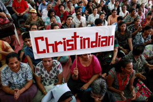 A protester holds a placard during a rally by hundreds of Christians against recent attacks on churches nationwide, in Mumbai, February 9, 2015. Five churches in the Indian capital New Delhi have reported incidents of arson, vandalism and burglary. The latest was reported last week when an individual stole ceremonial items. (PHOTO: REUTERS/DANISH SIDDIQUI) <br/>