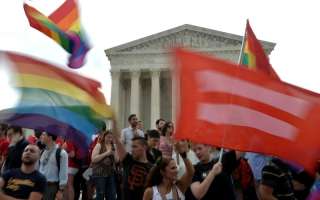 People celebrate outside the Supreme Court in Washington, DC on June 26, 2015. <br/>AP Photo