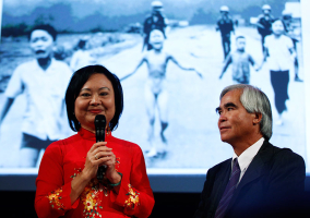 Photojournalist Nick Ut and Kim Phuc (L) attend the presentation of the latest Leica equipment at Photokina 2012, the world's largest fair for imaging, in Cologne September 17, 2012. Ut took the iconic 1972 Vietnam War photograph of Kim Phuc running naked down a road after being burned in a napalm attack near Trang Bang. More than 1,200 exhibitors from 45 countries will show their latest products at the Photokina 2012 from September 18-23. REUTERS/Ina Fassbender  <br/>
