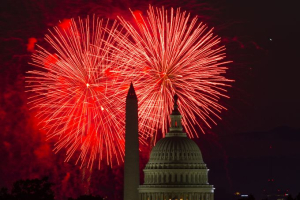 Fireworks illuminate the sky over the U.S. Capitol building and the Washington Monument during Fourth of July celebrations in Washington. <br/>AP Photo