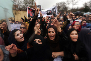 Afghan women chant slogans during a protest in downtown Kabul demanding justice for a woman who was beaten to death by a mob after being falsely accused of burning a Quran earlier this year.  <br/>AP Photo