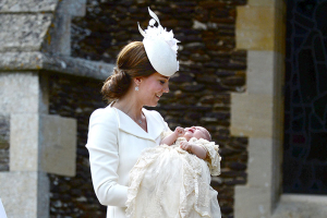 Catherine, the Duchess of Cambridge, carries her daughter Princess Charlotte into the Church of St Mary Magdalene on the Sandringham Estate for the princess's christening July 5th 2015. REUTERS/Mary Turner/Pool <br/>