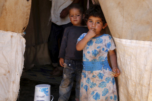 Syrian refugee children, who have been living in Jordan with their family for about two and a half years after fleeing the violence in their Syrian hometown of Idlib, are pictured in their family tent at an informal tented settlement in Madaba city, near Amman, Jordan, July 9, 2015. The number of Syrian refugees in neighboring countries has passed 4 million, the U.N. refugee agency UNHCR said on Thursday, adding that the total was on course to reach 4.27 million by the end of 2015. REUTERS/Muhammad Hamed <br/>