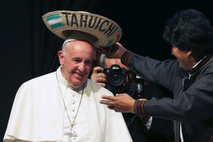 Pope Francis receives a typical sombrero from Bolivian President Evo Morales during a World Meeting of Popular Movements in Santa Cruz, Bolivia, July 9, 2015. The word 