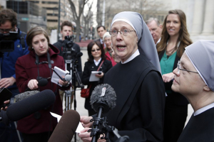 Sister Loraine Marie Maguire of the Little Sisters of the poor speaks to reporters in December 2014. Brennan Linsley / AP <br/>