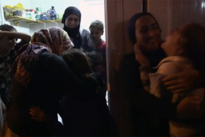Rescued Yazidi women and girls cry in languish. Photo: PBS <br/>