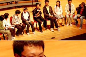 Top: In the section of “Hope”, seven Beichuan middle school teachers and students went on stage to share how a year after the disaster they have a different perspective towards life, are more stubborn towards life, and have became stronger. Bottom: De-Jun Wang’s right-hand was originally announced as permanently handicapped, but it recovered 60-70% after treatment. He raised his hands to show the audiences. (Photo: The Gospel Herald/Sharon Chan) <br/>(Photo: The Gospel Herald/ Sharon Chan) 