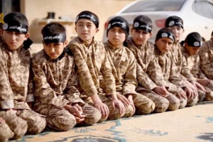 In propaganda videos released by ISIS, camouflage-clad boys are shown participating in drills, reciting verses from the Koran and undergoing weapons training. <br/>AP photo