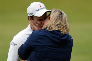 Zach Johnson of the U.S. kisses his wife Kim Barclay after winning the British Open golf championship on the Old Course in St. Andrews, Scotland, July 20, 2015 REUTERS/Russell Cheyne <br/>