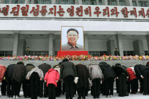 North Korean citizens bow before an image of the country's leader, Kim Jong Un <br/>Getty Images