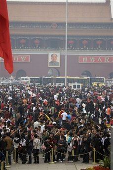 Tens of thousands of visitors crowd Tiananmen Square on the first day of the May holidays in Beijing, China, Friday, May 1, 2009. <br/>(Photo: AP Images / Ng Han Guan)
