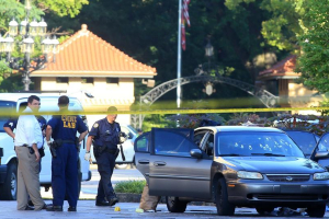 St. Louis police investigate the scene of a shooting where a gunman opened fire on a uniformed St. Louis police sergeant on Tuesday, July 14, 2015 in St. Louis.  <br/>Christian Gooden/St. Louis Post-Dispatch via AP)