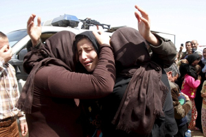 Yazidi women weep while in ISIS captivity in this photo from April 2015. <br/>Reuters