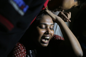 Ashamoni, wife of blogger Niloy Chakrabati, cries at her house in Dhaka, Bangladesh, on Friday after her blogger husband was hacked to death by suspected Islamist extremists. <br/>AP photo
