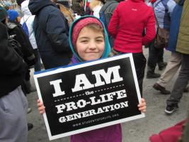 A young girl holds up a pro-life sign at the March for Life in Washington, D.C. (2013) <br/>AP photo